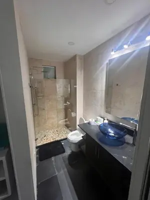 a bathroom with a shower and a toilet and a sink at Apartamento Cartagena Morros Epic con acceso directo a la playa in Cartagena de Indias