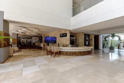 a lobby with a bar in the middle of a building at Apartamento de lujo en Cartagena Seaway935 - Morros in Cartagena de Indias