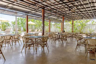 a group of tables and chairs in a restaurant at Apartamento de lujo en Cartagena Seaway935 - Morros in Cartagena de Indias