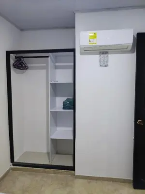 a closet with a mirror and a basketball hoop at Cabaña en condominio frente al mar #10 in Tolú
