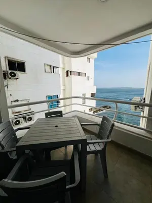 a balcony with a table and chairs on a ship at APTO 802 VISTA AL MAR in Cartagena de Indias