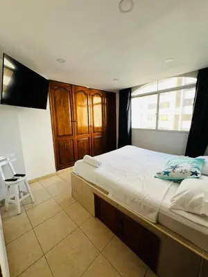 a bedroom with a large bed and a window at APTO 802 VISTA AL MAR in Cartagena de Indias