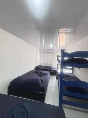 three bunk beds in a room with a ceiling at Cabaña Palma Azul in Coveñas