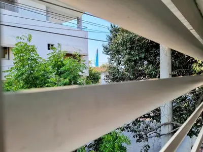 a view of the spire from the window of a building at Apartamento Cerca al Faro y la Playa in Puerto Colombia