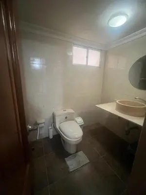 a bathroom with a toilet and a sink at A un paso del mar in Cartagena de Indias