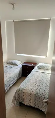 a bedroom with two beds at Espectacular apartamento piso 14 al norte de Barranquilla in Barranquilla