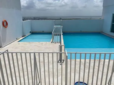 a swimming pool on the roof of a building at Apartamento cerca al Mar, en Cartagena COL in Cartagena de Indias