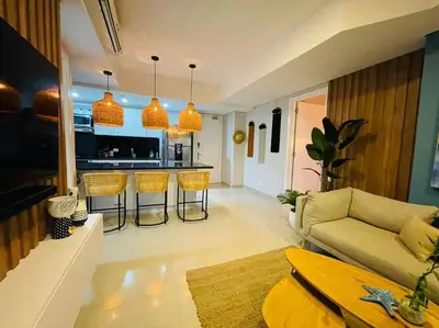 a living room with a couch and a kitchen at 2-2 Palmetto Eliptic 3403 Enchanted Jewel in Cartagena de Indias