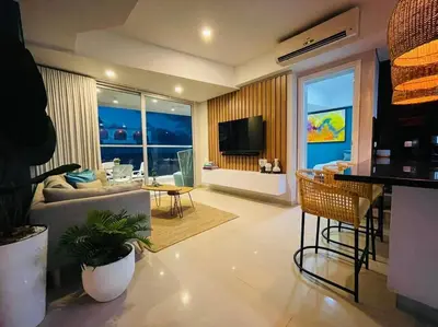 a living room with a couch and a television at 2-2 Palmetto Eliptic 3403 Enchanted Jewel in Cartagena de Indias