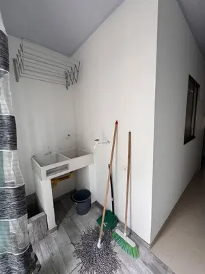 a bathroom with a sink and two mop at Summer - Apartamento Sector La Coquerita in Coveñas