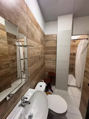 a bathroom with a sink and a toilet and a mirror at Summer - Apartamento Sector La Coquerita in Coveñas