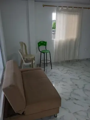a living room with a couch and two chairs at Apartamentos y habitaciones cerca a marbella in Cartagena de Indias