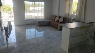 a living room with a couch and a table at Apartamentos y habitaciones cerca a marbella in Cartagena de Indias