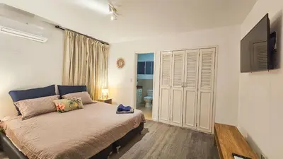 a bedroom with a large bed in a room at El Laguito Cartagena - Apartamento 2 habitaciones acceso directo a playa in Cartagena de Indias