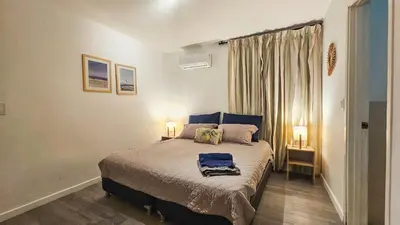 a bedroom with a large bed with two lamps at El Laguito Cartagena - Apartamento 2 habitaciones acceso directo a playa in Cartagena de Indias