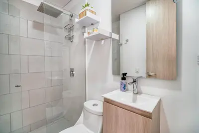 a bathroom with a toilet and a sink and a shower at Luxury Sea View Duplex in the Heart of the City in Cartagena de Indias