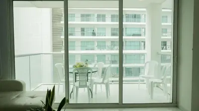 a dining room with a table and chairs on a balcony at Morros 3 in Cartagena de Indias