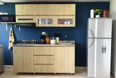 a kitchen with a white refrigerator and a counter at Apartamento familiar en Coveñas in Coveñas