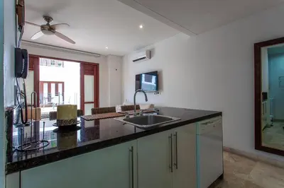 a kitchen with a sink and a counter top at Apartamentos 129 Casa del Virrey Eslava Centro Histórico in Cartagena de Indias