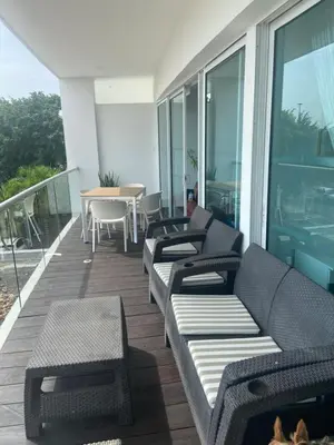 a balcony with couches and a table on a building at Cartagena Apartamento en Morros en Primera Linea de PLaya in Cartagena de Indias