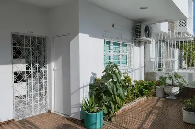 a courtyard with potted plants in a building at Maos flats-Habitacion comfort in Cartagena de Indias