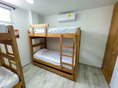 a room with two bunk beds in it at Apartamento Villa Carolina 102 in Coveñas
