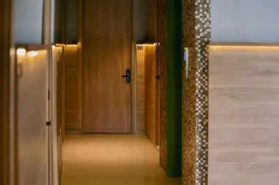 a hallway with wooden doors in a building at Mood Matuna Hotel Cartagena in Cartagena de Indias