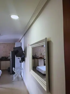 a mirror hanging on a wall in a room at Beach retreat in El Laguito in Cartagena de Indias