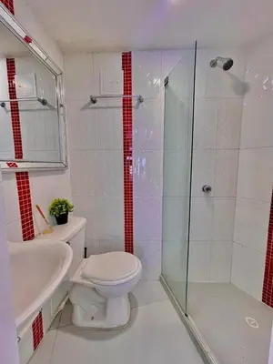 a bathroom with a shower and a toilet and a sink at Apartamento bonito en Cartagena ,el laguito bocagrande con vista al mar in Cartagena de Indias