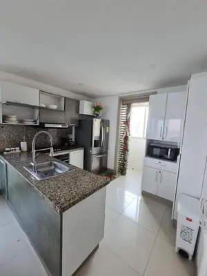 a kitchen with a sink and a counter top at Beachfront Luxurious Apartment, Palmetto Beach in Cartagena de Indias