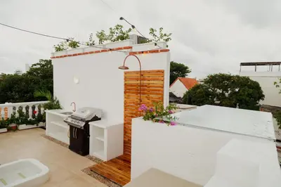 a bathroom with a sink and a toilet on a balcony at Spiritual Luxury 4BR Pool&Roofterrac Getsemani NEW in Cartagena de Indias