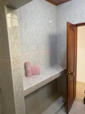 a shower with a pink pillow sitting on a shelf at Castillo de la Popa in Cartagena de Indias