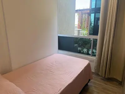 a small bedroom with a bed and a window at Ciudad Mallorquin in Puerto Colombia