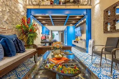 a living room with a couch and a table at Casa Santino Luxury Getsemaní-Cartagena in Cartagena de Indias