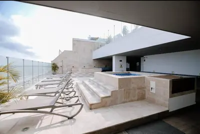 a group of lounge chairs sitting on a building at Apartamento con salida privada a la playa en Morros, Cartagena in Cartagena de Indias