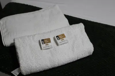 a white pillow with two price tags on it at Hospedaje san gabriel in Barranquilla