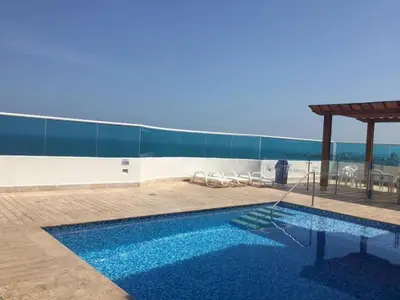 a swimming pool on top of a building at Sleep by the Caribbean in Cartagena de Indias