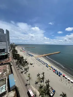 a view of a beach with umbrellas and the ocean at Sleep by the Caribbean in Cartagena de Indias