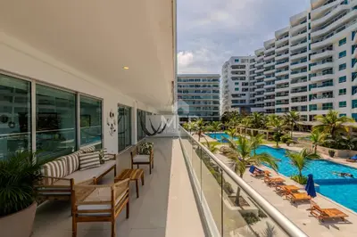 a balcony of a hotel with a swimming pool at Morros Epic Beachfront Apartment in Cartagena de Indias