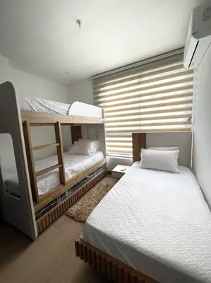 a room with two bunk beds and a window at New Luxury Apartment in Cartagena in Cartagena de Indias