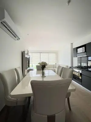 a kitchen with a dining room table and chairs at New Luxury Apartment in Cartagena in Cartagena de Indias