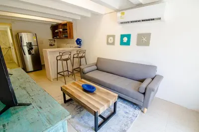 a living room with a couch and a table at Santo Domingo - Centro Histórico in Cartagena de Indias