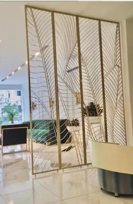 a room with a large window with a table and chairs at Hotel OR Suite in Barranquilla