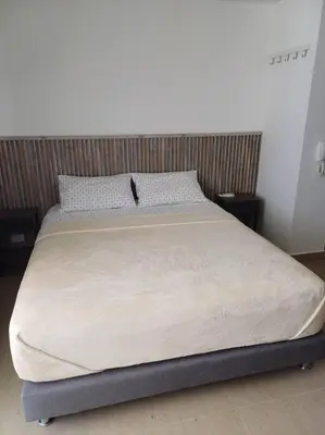 a large bed in a bedroom with at New Apartment very close to Airport and beaches in Cartagena de Indias
