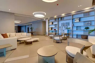 an office lobby with white furniture and tables at Awesome Oceanfront “Morros City” 29th floor 2R/3BR in Cartagena de Indias