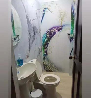 a bathroom with a toilet and a sink at Casa rosymar in Cartagena de Indias