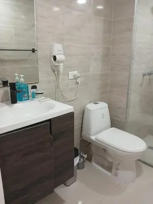 a bathroom with a toilet and a sink and a shower at Cartagena Beach Resort cerca al aereopuerto in Cartagena de Indias