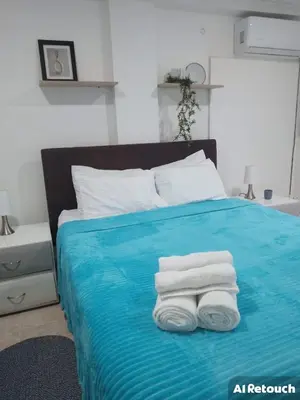 a bed with three towels sitting on top of it at Apto espectacular frente al mar in Cartagena de Indias