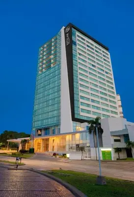 a large office building with a large building at Apartamento Hotel Estelar Alto prado Junior Suite in Barranquilla