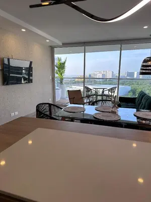 a dining room with a view of the ocean at DQ1301 | 2H Jacuzzi privado + piscina infinita in Cartagena de Indias